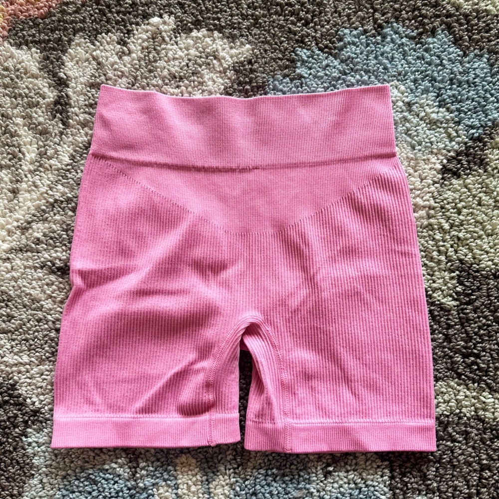 Pink ribbed biker shorts with 5 inch inseam. Size small.